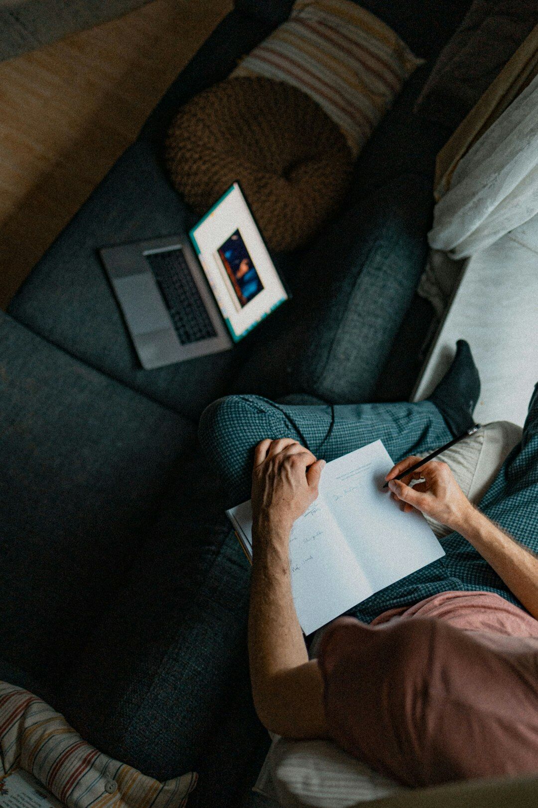 person searching cars from home couch