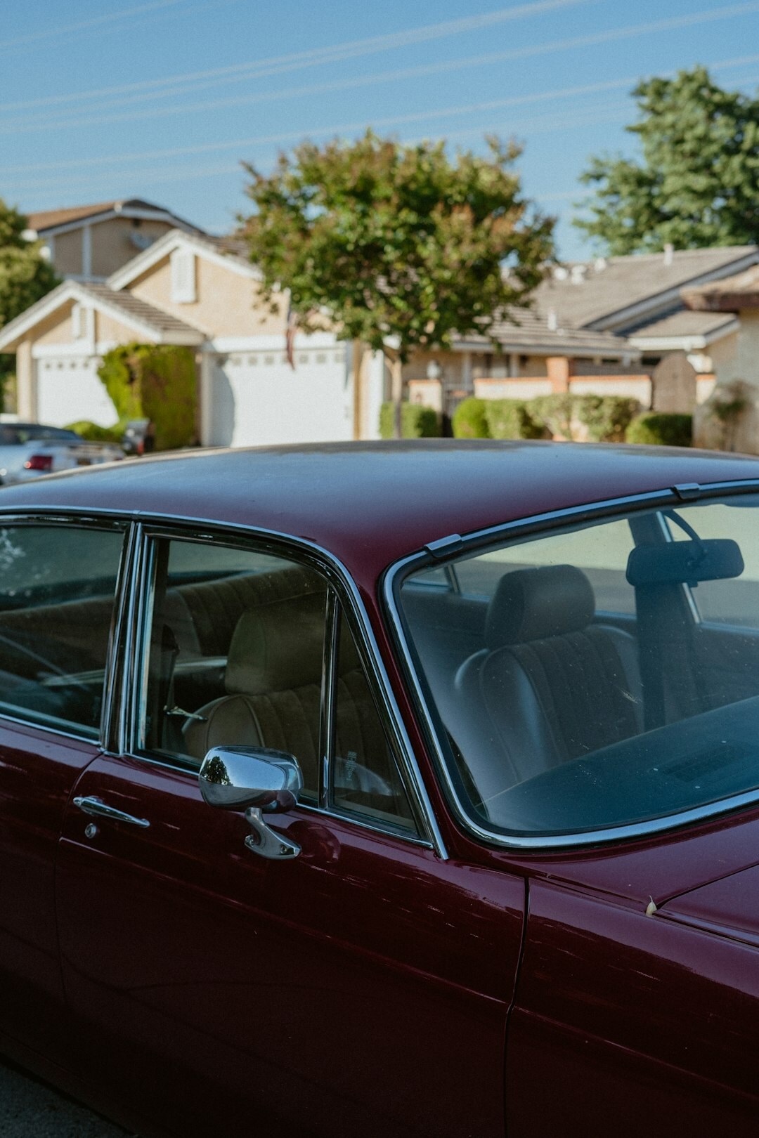 Restored burgundy vintage convertible car from the 1960s